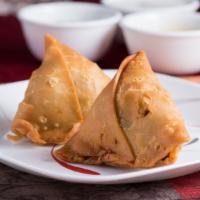 Vegetable Samosa · Pastry with vegetable stuffing.