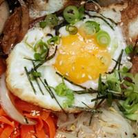 Vegetable Bibimbap · Steamed rice spinach bean sprouts carrots mushrooms zucchini daikon dried seaweed and egg.
