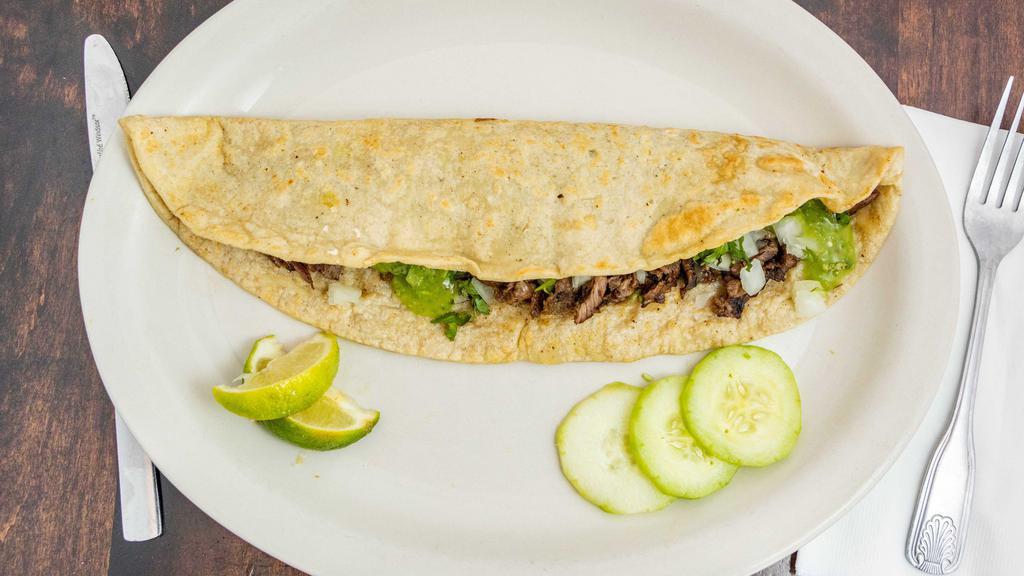 Quesadilla De Carne · With cheese, cilantro, onion, and salsa on the side.