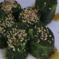 Horenso Oshitashi · Spinach with soy/bonito based sauce with sprinkles of seaweed and bonito flakes.
