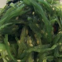 Combination Seaweed Salad · Variety of seaweed on a bed of lettuce with sesame dressing.