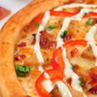 Chicken Bacon Ranch Pizza · Ranch, Mozzarella, Chicken, Bacon, Red Pepper, Green Onion and a spiral of Ranch