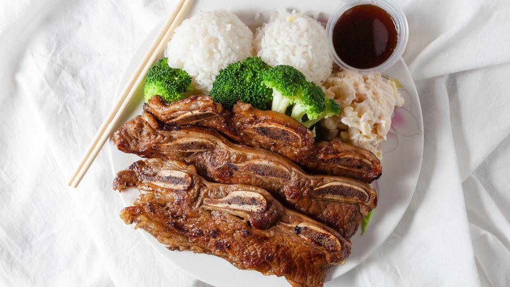 Kalbi Short Ribs · Tender beef short ribs marinated in Korean Style BBQ sauce, then grilled to perfection.