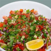 12. Choban Salad · Tomatoes, cucumbers, onions, parsley, lemon, olive oil and sumac.