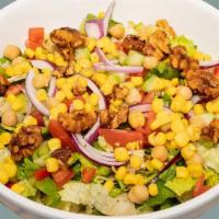 13. Mediterranean Salad · Mixed greens, garbanzo beans, corn, red onions, tomatoes, topped with caramelized walnuts an...