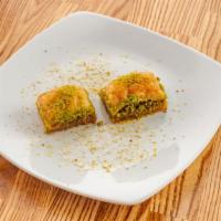 34. Baklava · Sweet dessert pastry made of layers of fill filled with chopped pistachio and sweetened toge...