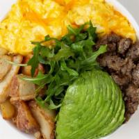 Chicken Sausage Breakfast Bowl · 2 Fried Eggs, Chicken Sausage, Crispy Potatoes, Shredded Cheese, and Sliced Avocado over Aru...