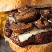 The Mushroom & Swiss Burger · Juicy 1/3 pound grilled beef burger with sautéed mushrooms and onions with melty Swiss chees...