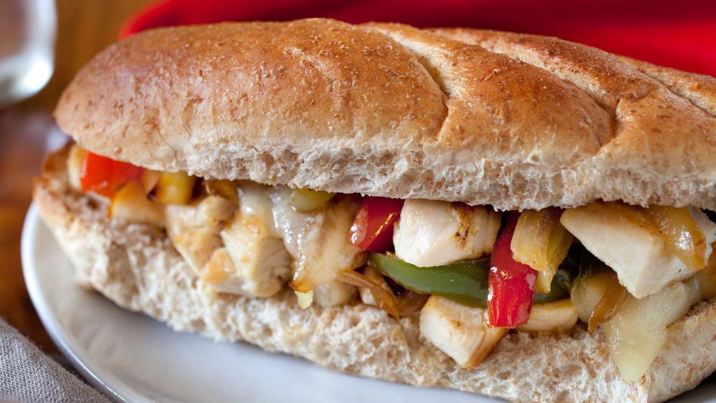 Chicken Philly Style Sub · Chicken Philly cheesesteak with tender, chopped, grilled chicken, your choice of melty cheese, grilled onions and peppers on a crusty French roll.