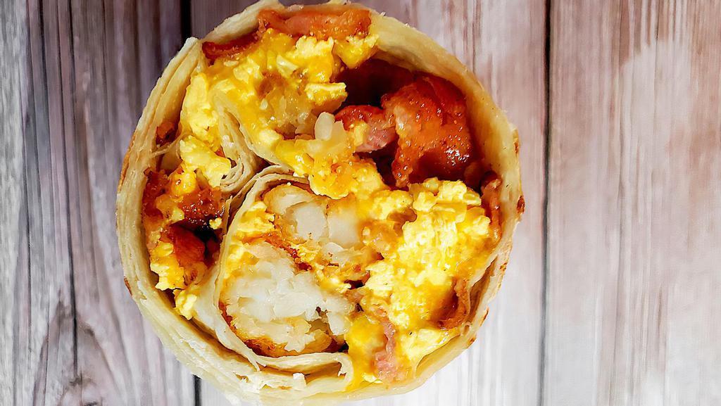 Classic Breakfast Burrito · Your choice of ham, bacon, or sausage with tots, scrambled eggs, and cheese.