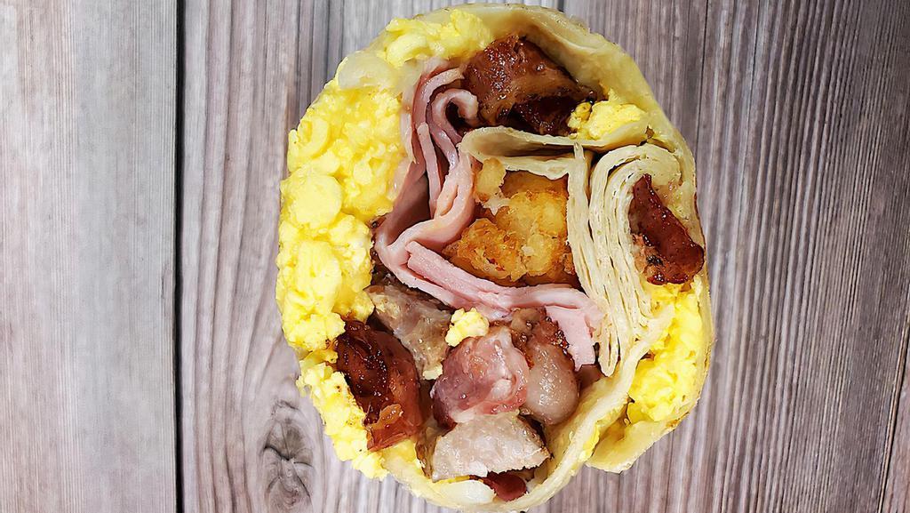 Meat Eater Breakfast Burrito · Bacon, ham, sausage with tots, scrambled eggs, and cheese.