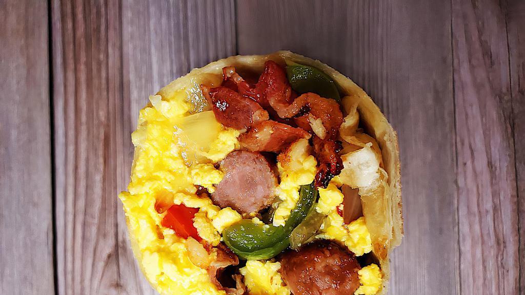 Meat & Veggie Combo Breakfast Burrito · Your choice of two meats with grilled onions, bell peppers, and mushrooms, tots, scrambled eggs, and cheese.