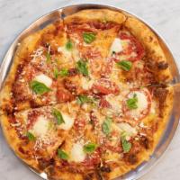 Margherita Pizza · Red sauce, three cheese blend, topped with mozzarella, fresh basil.