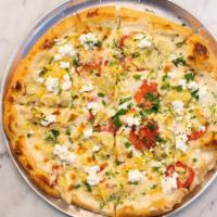Artichoke Formaggi Pizza · Béchamel sauce, three cheese blend, topped with fresh Roma tomato & feta parsley blend.