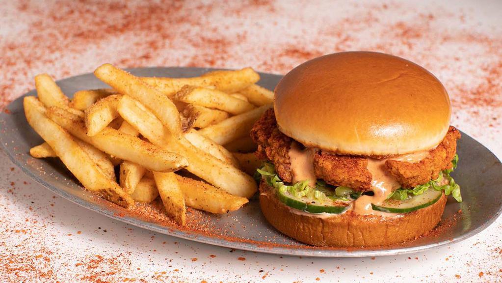 Nashville Hot Af Tender Sandwich · 3 hand-breaded crispy chicken tenders served on buttery brioche bun with housemade pickles and shredded lettuce. Served with a side of seasoned fries.