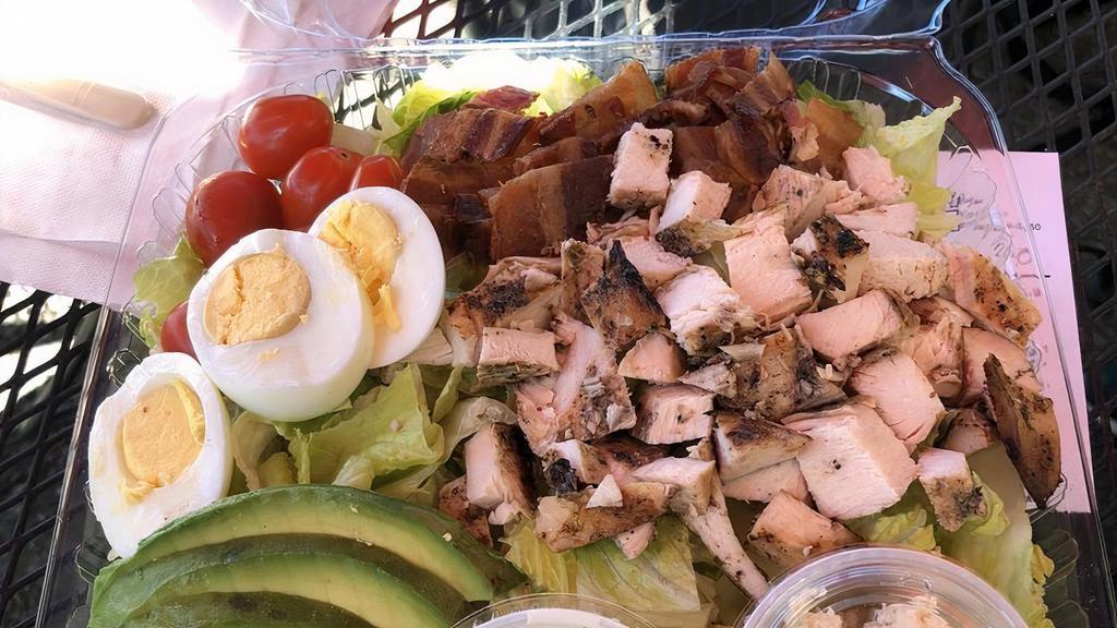Cobb Salad · Romaine Hearts, Chicken breast, Bacon, Tomato, Egg, Blue cheese, Avocado, Blue cheese dressing