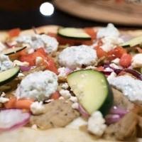 Chicken Gyro Pizza · White pizza sauce marinated chicken gyro meat tomatoes cucumber feta cheese and drizzles wit...