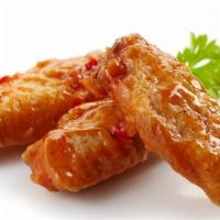 Cajun Sweet n' Sour Chicken Wings · Deep fried crispy chicken wings tossed in our delicious and tangy Cajun spiced Sweet n' Sour...