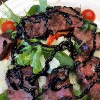 Flat Iron Steak Salad · Spinach and arugula with 28day aged flat iron steak, cherry tomatoes, bell peppers and shave...