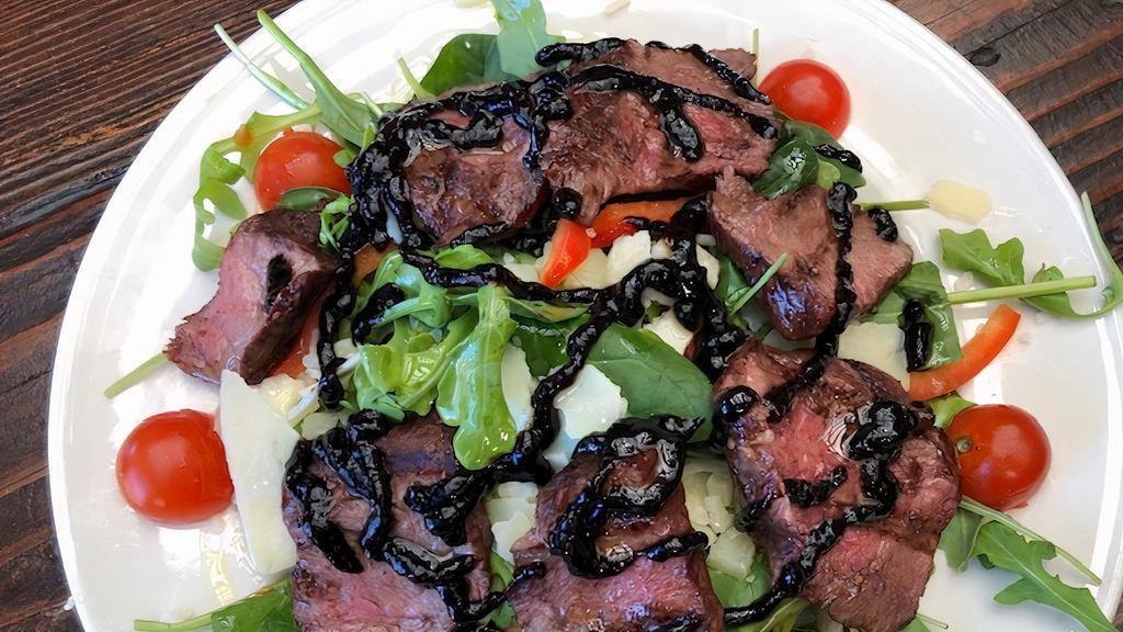 Flat Iron Steak Salad · Spinach and arugula with 28day aged flat iron steak, cherry tomatoes, bell peppers and shaved Grana Padano with a balsamic glaze drizzle and olive oil.