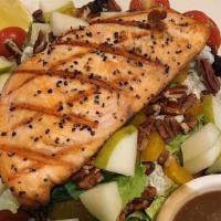 Salmon Salad · Grilled Salmon with a spring mix with blue cheese crumbles, mandarin oranges, pears and peca...