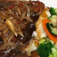 Bangers and mash · Two bangers in a white wine gravy with sauteed tomatoes and onions. Served with mash and veg...