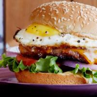 Egg cheese burger · Beef party ,fried egg, cheese letuce tomatoes onions and pikles