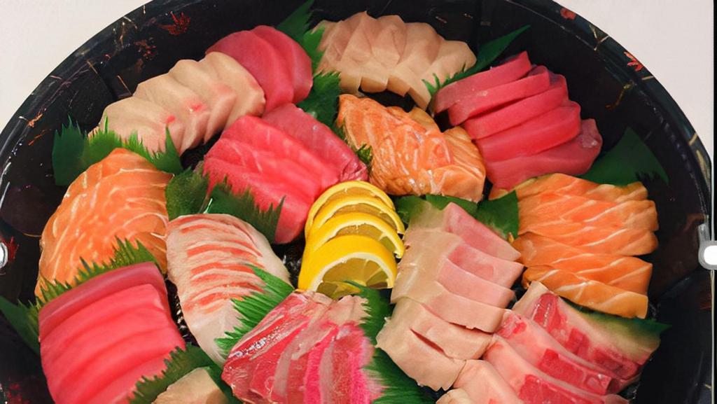 78. Sashimi Combo (20pcs) · A mix of Tuna, white-Tuna, salmon, hamachi, and tai.