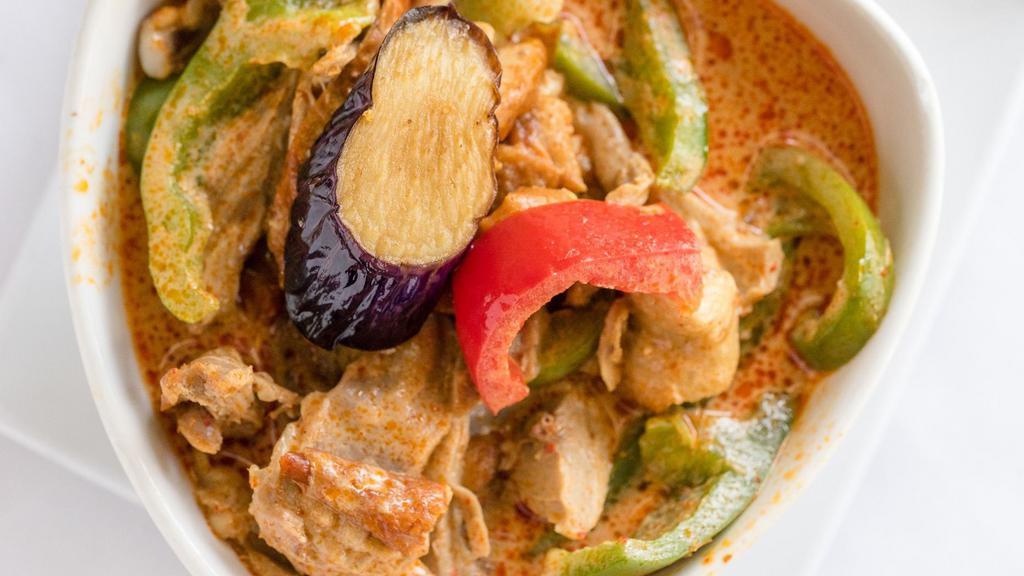 Duck Curry · Red curry, bamboo, bell peppers, onions, and basil.