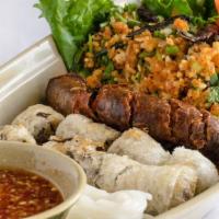 14. Champa Sampler · Contains nuts. Lao sausages, fried rice ball salad, and fried spring rolls.