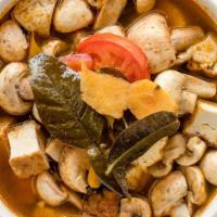 33. Tom Yum · Thai's hot and sour soup in tomato, mushrooms, ginger basil and kafir leaves, with a choice ...