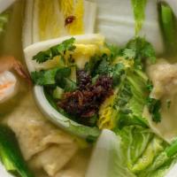 31. Wonton Soup · Chicken, shrimp, and pork wontons in chicken broth with spinach, cilantro, green onions, and...