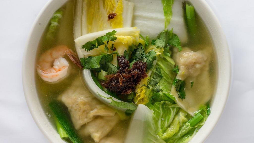 31. Wonton Soup · Wontons served in a chicken broth with Napa cabbage, carrots, and green onions.