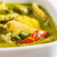69. Green Curry · Thai green chili curry, eggplant, basil, & choice of meat.
