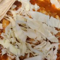 Pozole · Traditional Pozole in red sauce served either pork or chicken with homony cabbage and radishes
