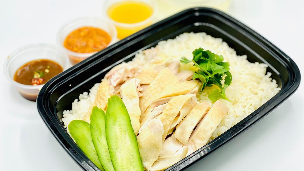 Organic Chicken Rice (Tender Breast only) · chicken flavored jasmine rice topped with organic tender chicken breast, broccoli  and cilantro, plus two choice of the following sauce ; popular Red Sauce: spicy ginger garlic sauce, Black Sauce: spicy soy miso sauce or Lemon Sauce.