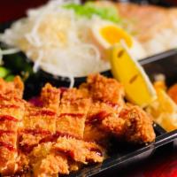 Chicken Katsu Bento · Chicken cutlet, edamame, takoyaki, soft- boiled egg*, fried gyoza, shredded cabbage, tender ...