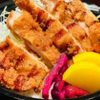 Chicken Katsu Don · Chicken cutlet over rice with  Japanese pickles