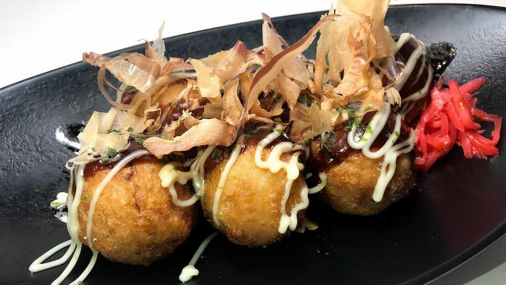 Takoyaki (6 pcs) · 6 pcs deep fried octpus filled balls, topped with takoyaki sauce and mayonnaise with bonito flakes.