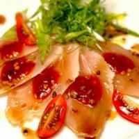 Spicy White Tuna Garlic Carpaccio · White tuna sashimi and sliced garlic onion in spicy sauce