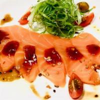 Spicy Salmon Carpaccio · Salmon sashimi and onions in spicy sauce