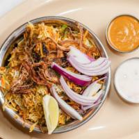 Chicken Dum Biryani · Basmati rice cooked with authentic herbs and Indian spices in dum style with boned chicken m...