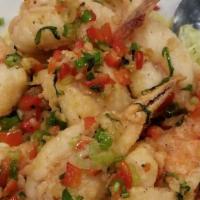 Salt and Pepper Prawns · Hot and spicy. Lightly battered prawns fried to golden perfection tossed in a dry wok with g...