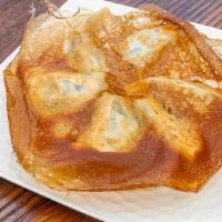 Hanetsuki Gyoza · Housemade pork dumplings with crispy thin crust served with spicy sauce.