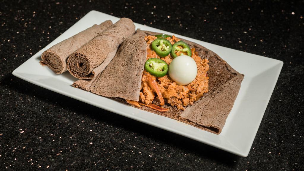 Fir-Fir · Shredded injera, onion, jalapeño, and berbere (hot spice) with/without kibe (Ethiopian butter).