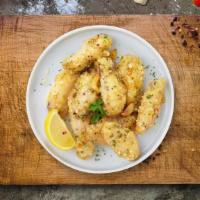 Garlic Magic Parm Wings · Fresh chicken wings breaded and fried until golden brown and tossed in garlic parmesan sauce...