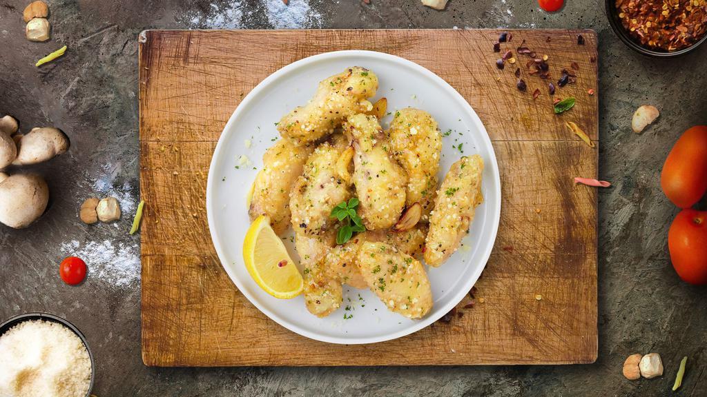 Garlic Magic Parm Wings · Fresh chicken wings breaded and fried until golden brown and tossed in garlic parmesan sauce. Served with a side of ranch or bleu cheese.