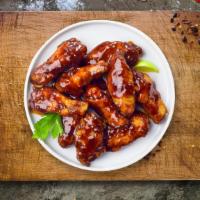 Cookout Wings · Fresh chicken wings breaded and fried until golden brown and tossed in BBQ sauce. Served wit...