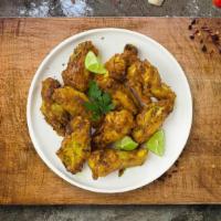 Sour & Peppery Wings · Fresh chicken wings breaded and fried until golden brown and tossed in lemon pepper sauce. S...