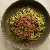 Ground Beef Pesto Zoodle · Zucchini spaghetti with homemade pesto sauce, ground beef and Parmesan. Gluten free.